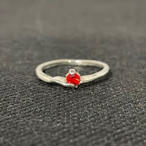 Small thin ring with a small red gem